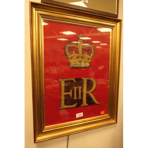 429 - Framed gilt threadwork 'ER' cipher and crown from the tunic of a Household Cavalry bandsman, overall... 