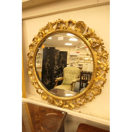 446 - Florentine style carved gilt wood framed circular wall mirror, diameter 68cm