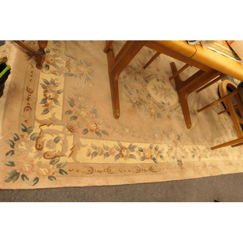 592 - Chinese sculpted pink ground woollen rug, 250cm x 66cm
