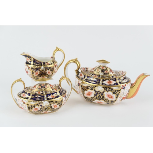 13 - Royal Crown Derby three piece tea service, in traditional imari colours, pattern 2451, circa 1906/07... 