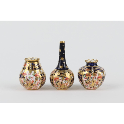 18 - Three Royal Crown Derby miniature vases, comprising a Persian inspired miniature bottle vase, patter... 