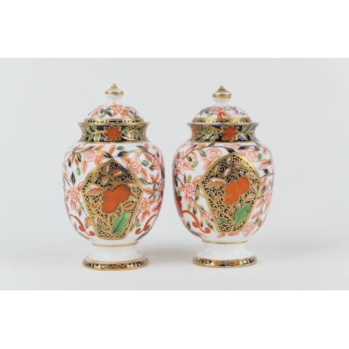 3 - Matched pair of Crown Derby Porcelain imari lidded vases, circa 1878-1887, ovoid form with domed cov... 