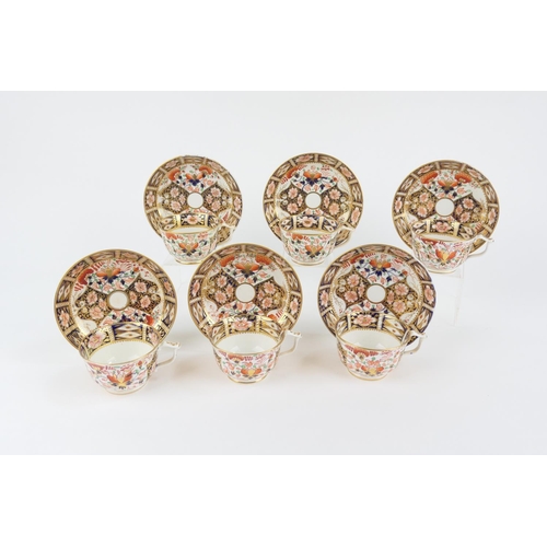 31 - Six Derby old imari cups and saucers, circa 1800-25, the pattern akin to 6299, painted red baton mar... 