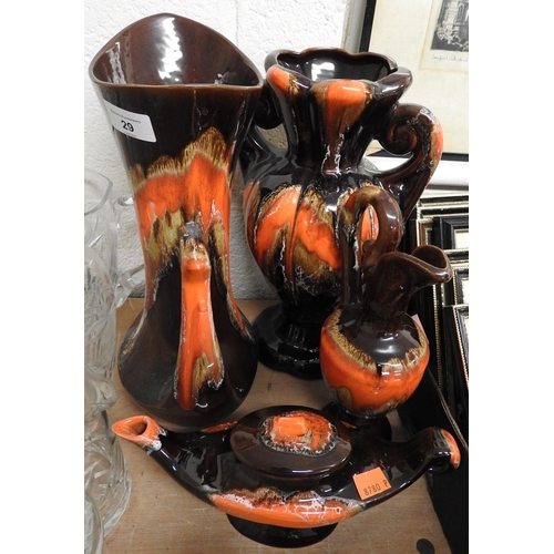 29 - Four items of lava style orange and brown glazed pottery