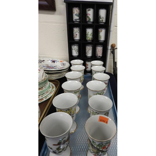 73 - Franklin Porcelain limited edition teacups, the twelve months of the year, with display shelf; also ... 