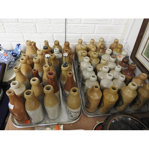 24 - Collection of named salt glazed stoneware  bottles including a E R Jones & Sons XXX stone barn beer,... 