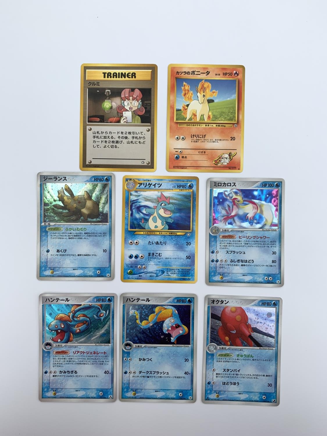 a-mixed-group-of-8-japanese-pokemon-cards-includes-5-holographic-cards