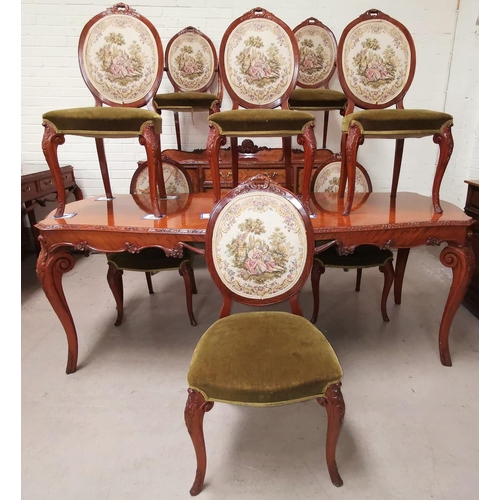 537 - A Louis XV style carved and quarter veneered dining suite in the manner of Epstein, comprising shape... 