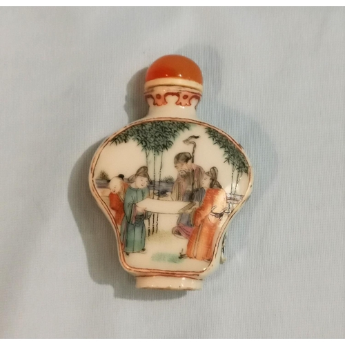 262 - A Chinese porcelain famille verte snuff bottle of flattened baluster form decorated with genre scene... 