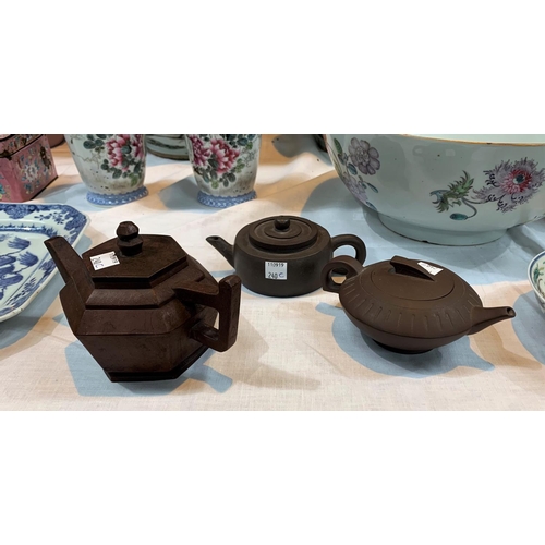 240c - Three Chinese 'Yixing' terracotta teapots with impressed seal marks to bases, lengths 7
