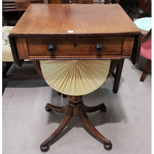 594 - A Regency period mahogany work table with twin drop leaves and frieze drawer, 'U' shaped sliding bag... 