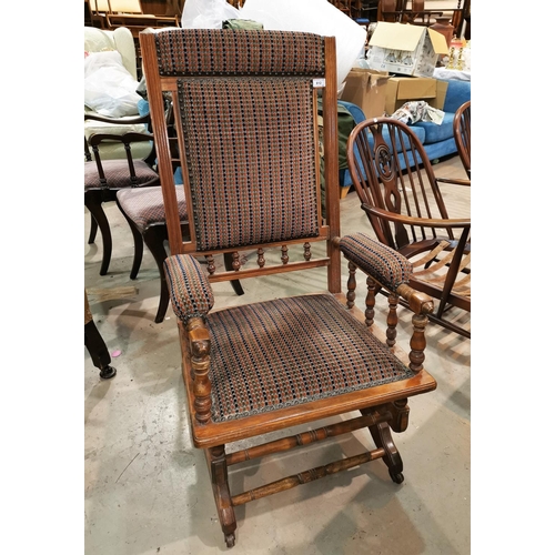 612 - A late 19th century American rocking armchair
