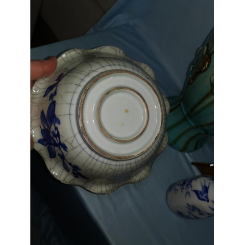 102a - A Japanese Kutani porcelain bottle vase, 18 cm; a bowl with craquelure glaze, 22 cm; a large orienta... 