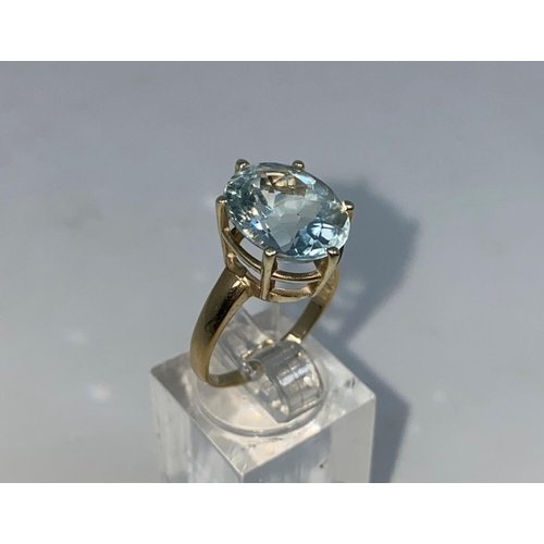 364 - A lady's 9 carat hallmarked gold dress ring set with a large aquamarine coloured stone , size N1/2, ... 