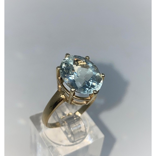 364 - A lady's 9 carat hallmarked gold dress ring set with a large aquamarine coloured stone , size N1/2, ... 