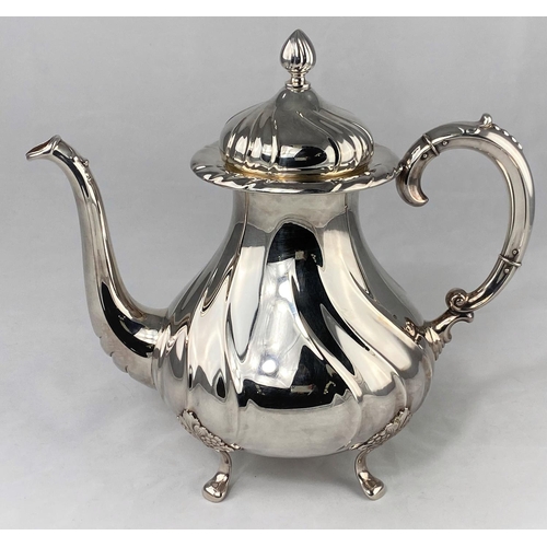 300 - A Swedish silver coffee pot of spiral ribbed baluster form with flame finial and 4 feet, 3 crown mar... 