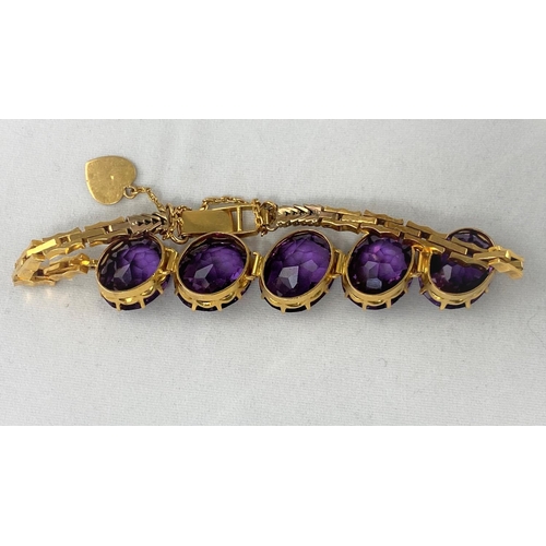 301 - A yellow metal bracelet tests 14ct set with 5 large oval amethysts 23.9g