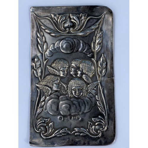 510 - A 1920's hallmarked silver book cover embossed with cherubs, 12 x 7cm