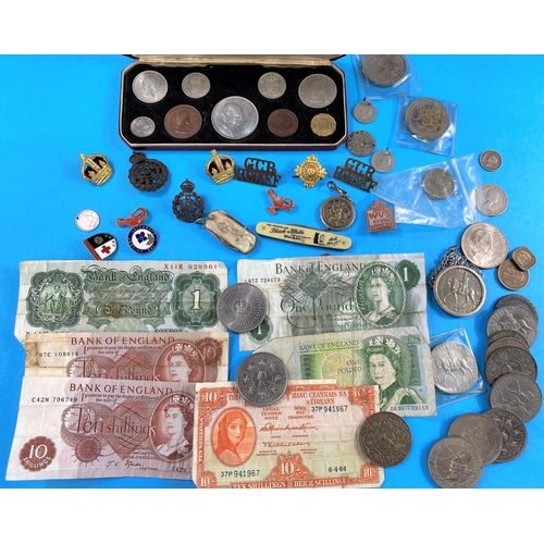 557 - A selection of coins, badges etc