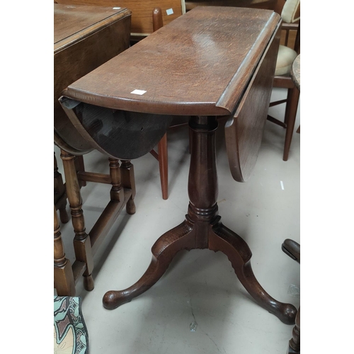 722 - A 19th century occasional table with circular drop leaf top on pedestal base