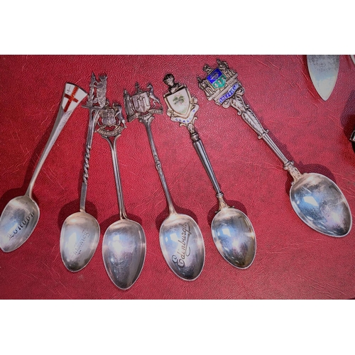 555 - A mixed selection of silver plated and white metal items including button hooks, decanter labels etc