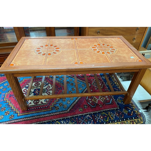 733 - A teak tile top coffee table, 87 cm; a G-Plan table and a bedding box
