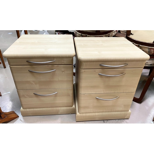 741 - A modern pair of 3 height bedside cabinets in wood effect
