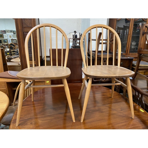 769 - A set of 4 Ercol lightwood and elm hoop and stick back dining chairs