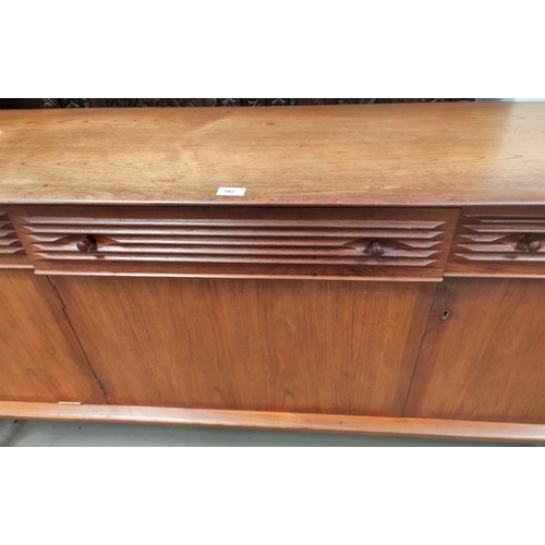 702 - A 1960's teak lowline sideboard by Dalescraft