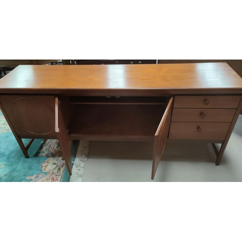 795 - A mid 20th century Nathan 'Circles' teak sideboard, with three cupboards featuring circles, three dr... 
