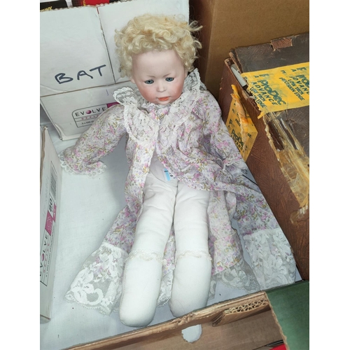 301 - An early/mid 20th century girl doll with bisque head and closing eyes, impressed '6', in modern flor... 