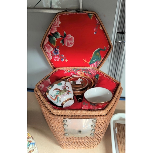 34 - A Japanese porcelain picnic set in woven basket