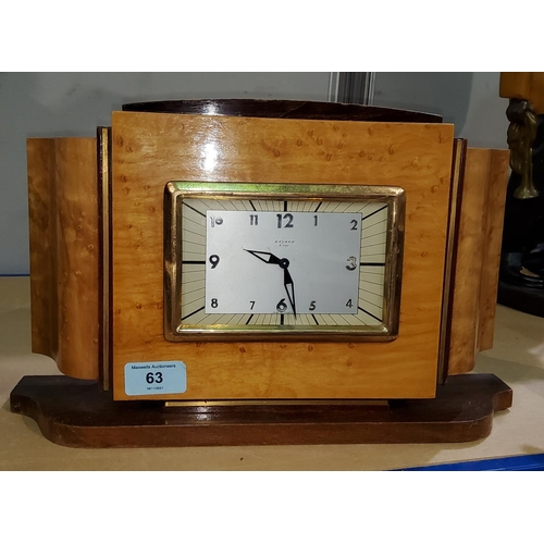 63 - A mantel clock, the Art Deco case in dark wood with bird's eye maple veneer