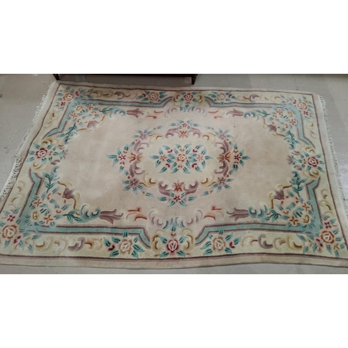 903 - A Chinese rug with fawn ground