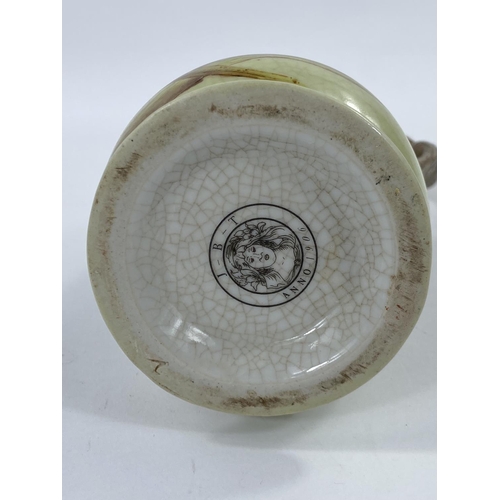504 - J.B.T. ANNO 1906, Art Nuveau style ceramic jug with brass mermaid handle, height 23cm.