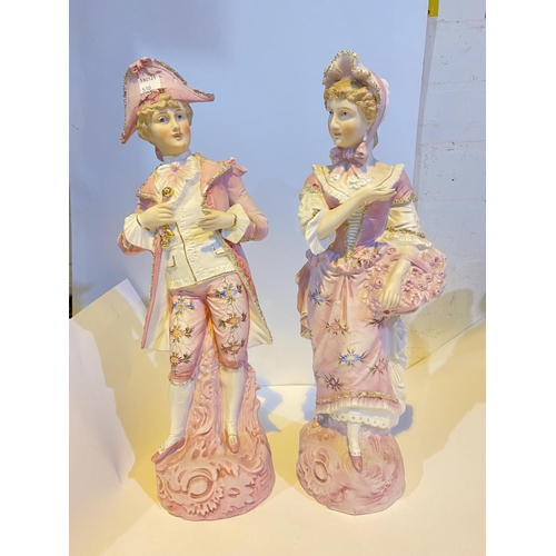 510 - A pair of 19th Century 'Chantilly' bisque figures in 18th century dress