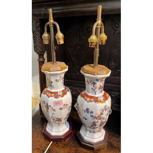 515 - A pair of Chinese octagonal table lamps with double light fittings to each