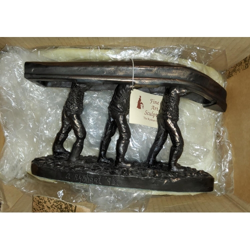 10F - A 'The Rynhart Collection' 'Men of Aran' bronze effect sculpture of three men carrying a Canoe on th... 