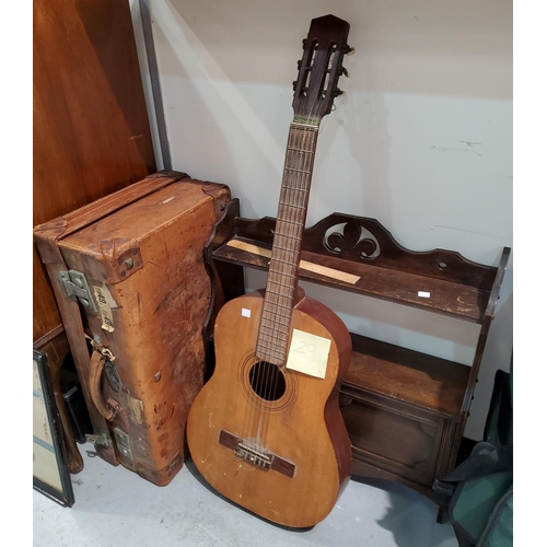 29 - A vintage leather suitcase; a Spanish guitar; a small cupboard