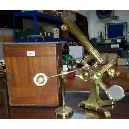 54 - A 19th century brass binocular microscope by J Swift, University St, London W.C., with one inch and ... 