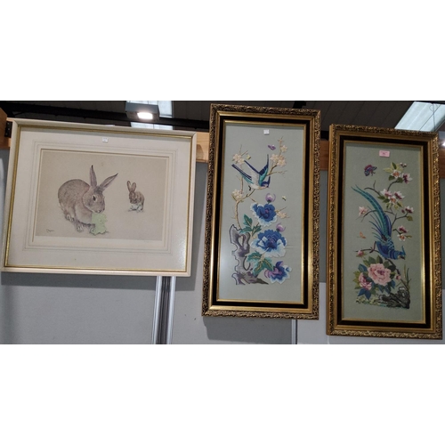 71 - A modern Chinese pair of embroideries depicting exotic birds in foliage, 65 x 30 cm, framed and glaz... 