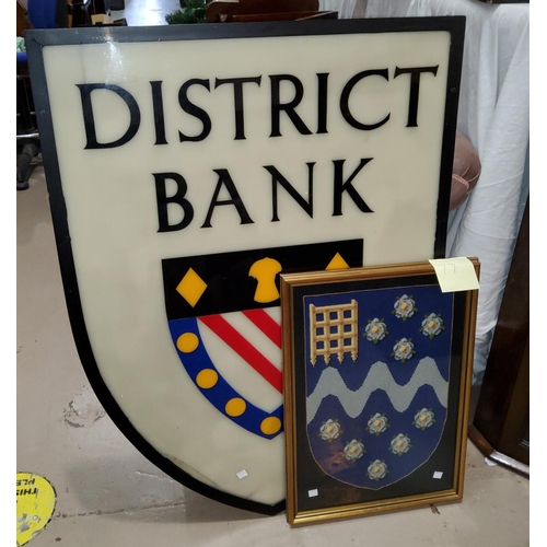 77 - District Bank:  a large Perspex sign; a tapestry