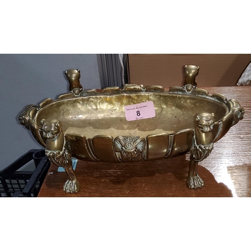 8 - A brass oval serving dish with sun burst decoration on 4 lion's paw feet with lion's heads and 4 ram... 