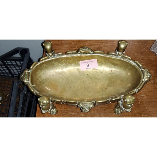 8 - A brass oval serving dish with sun burst decoration on 4 lion's paw feet with lion's heads and 4 ram... 