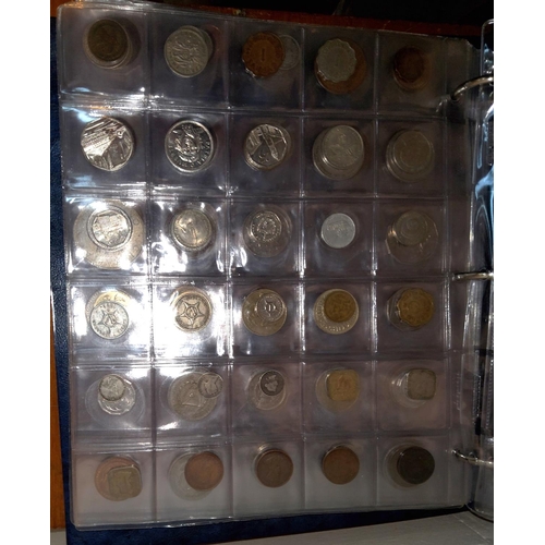 43 - A collection of coins from islands around the world in album:  Ceylon; Samoa; New Guinea and ot... 