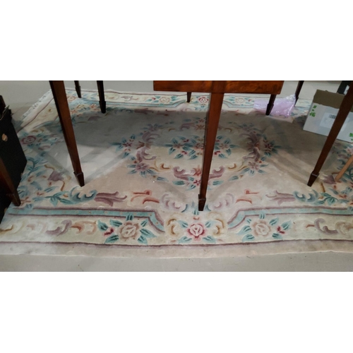 903 - A Chinese rug with fawn ground