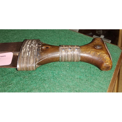 105 - A Middle Eastern curved blade horn handle and white metal mounted ceremonial dagger, length 30cm