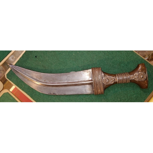 105 - A Middle Eastern curved blade horn handle and white metal mounted ceremonial dagger, length 30cm