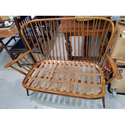 915A - An Ercol two seater stick back settee