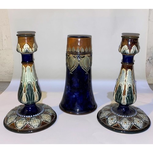 514 - A pair of Doulton Lambeth Art Nouveau style stoneware candlesticks, decorated with stylised leaves a... 